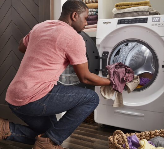 a man using & maintaining a dryer