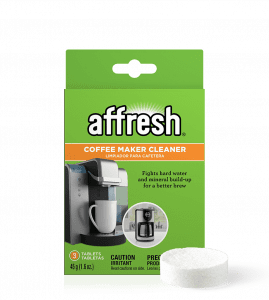 A close-up of the 3-count package of affresh® coffee maker cleaner tablets designed to fight hard water mineral buildup with a single tablet in front.
