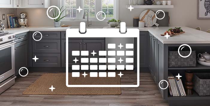 Calendar overlays a clean kitchen with a dishwasher and stove.