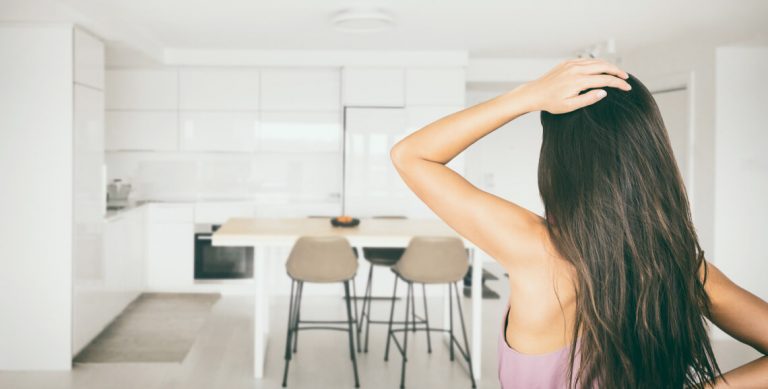 person trying to diagnose a kitchen odor