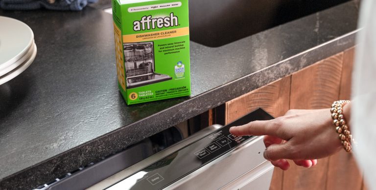 A person starts a dishwasher wash cycle with affresh® dishwasher cleaner.