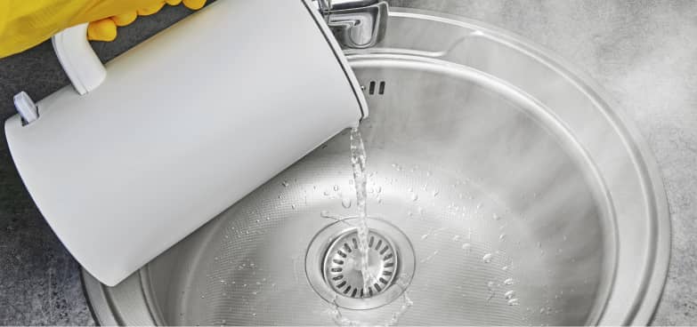 Pouring water in a sink