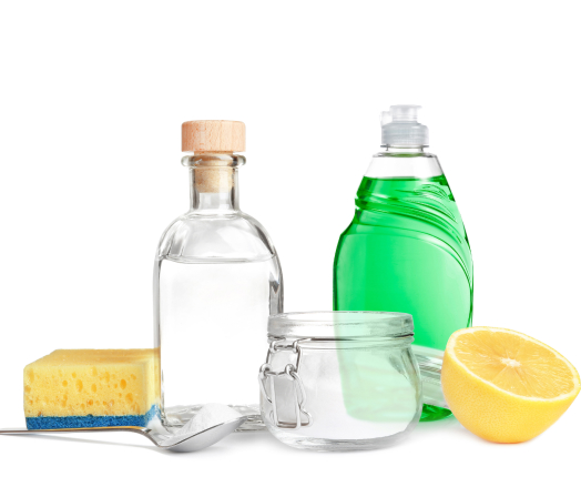 Vinegar, generic dish soap and lemon juice cleaning ingredients used in natural solutions to remove soap scum from appliances